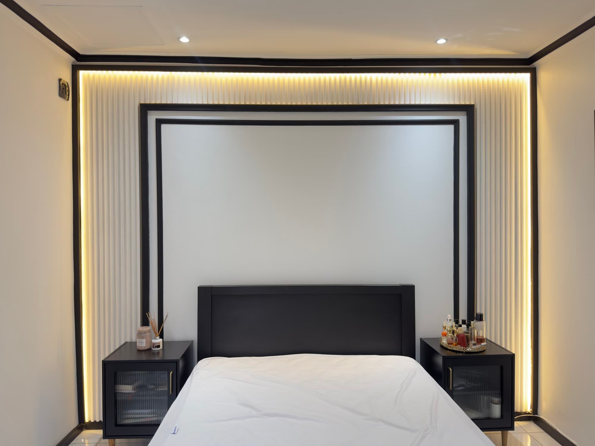 Pleated panel bedroom feature wall, black trim