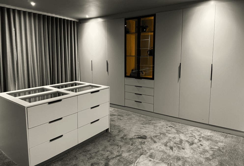 Walk-in closet, white gloss wardrobes and island