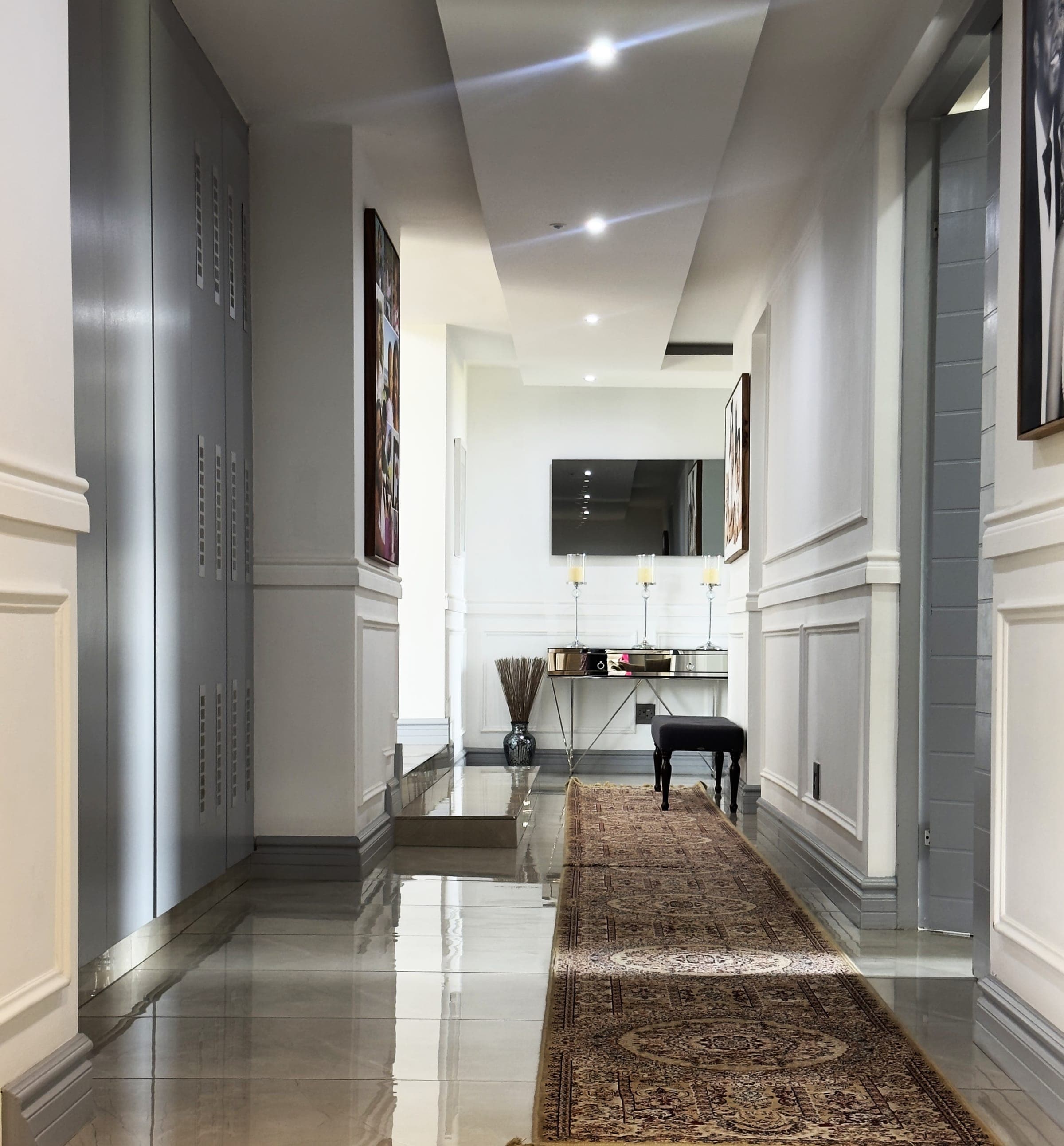Panelled hallway, mirrored console and runner