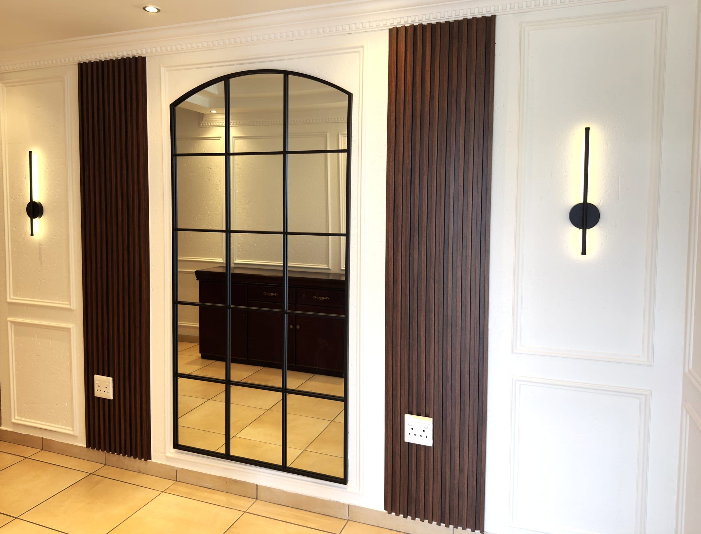 Hallway, arched mirror inset with fluted panel surround