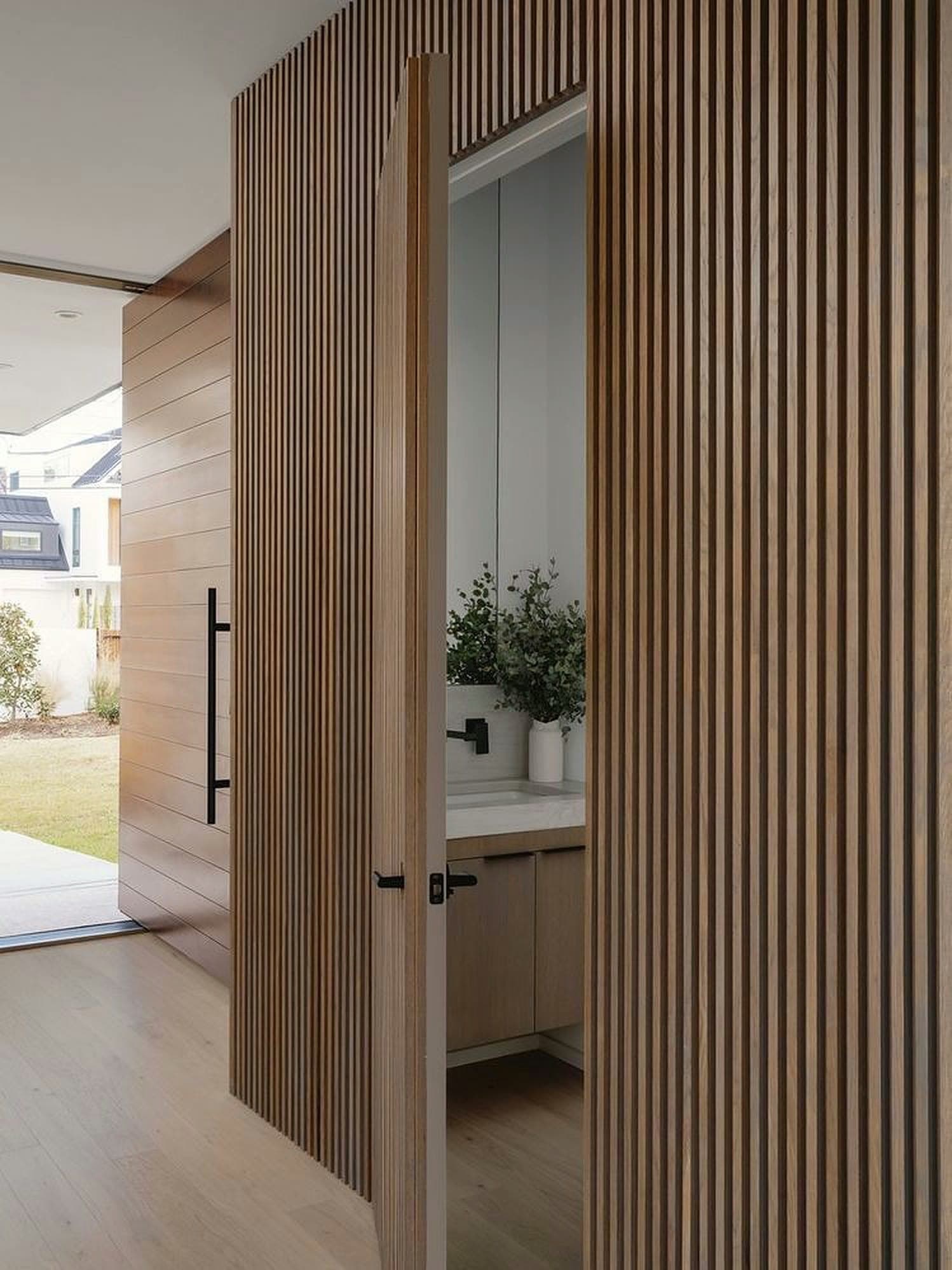 Finish reference — oak slat, entry door